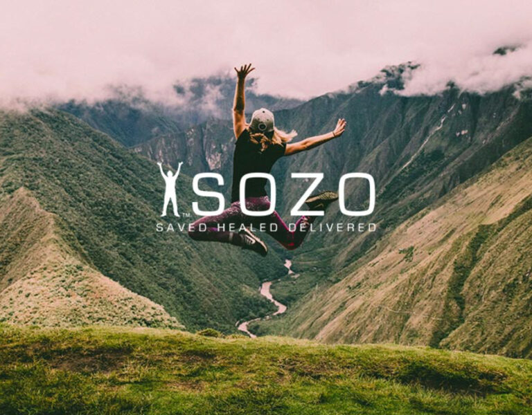 SOZO logo over an image of a man on a mountain jumping into the air joyously